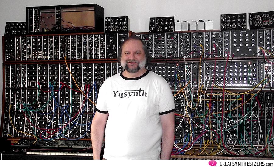 Yves Usson (aka yusynth) in front of his beloved analogue modular synthesizers (left : home-made yusynth modular; right : synthesizers.com modular).