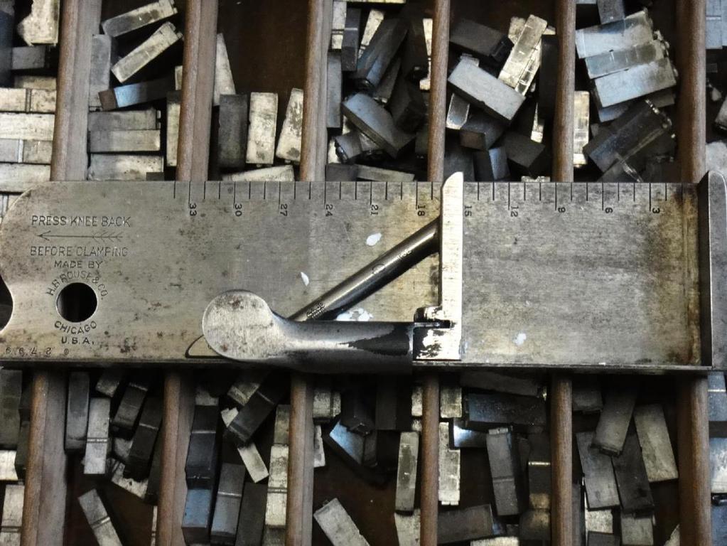 COMPOSING STICK Used for hand-composing metal type, composing sticks came in different lengths and allowed compositors to assemble several lines of type at once, choosing letters and