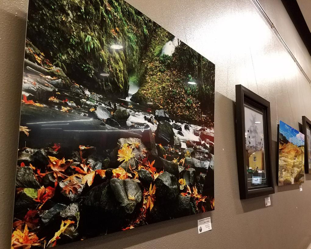 Local photographer Randy Blevins is exhibiting on the gray ramp wall.