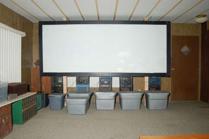 A view from a cinema chair. Projector to screen is 14 feet. The original screen from the 26 foot basement theater. To use properly here, it will be soon matted down slightly.