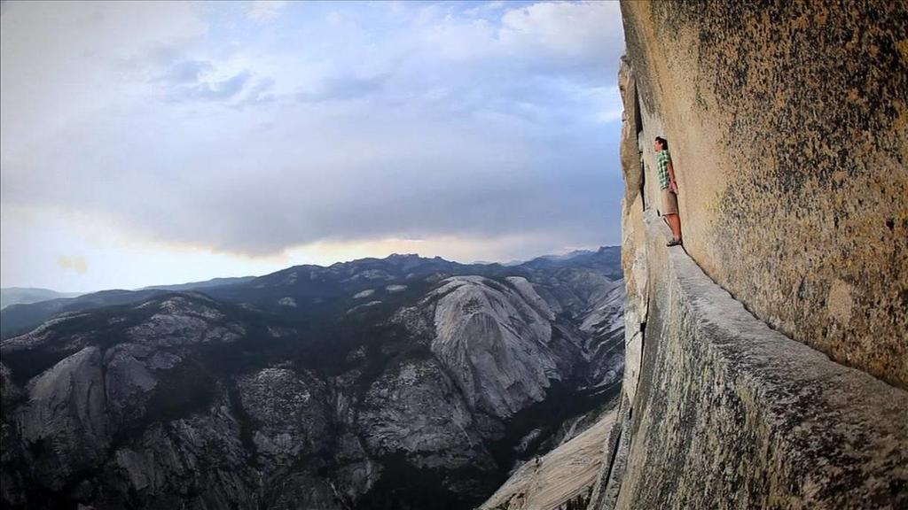 Choose your ending - Optimist or Pessimist On a bright Saturday morning in September, a young man is clinging to the face of Half Dome, a sheer 2,130-foot wall of granite in the heart of Yosemite