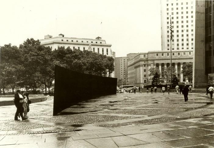 Figure 2.3: Richard Serra, Tilted Arc as seen from the side, (1981). Steel panel sculpture, 12 x 120 ft.