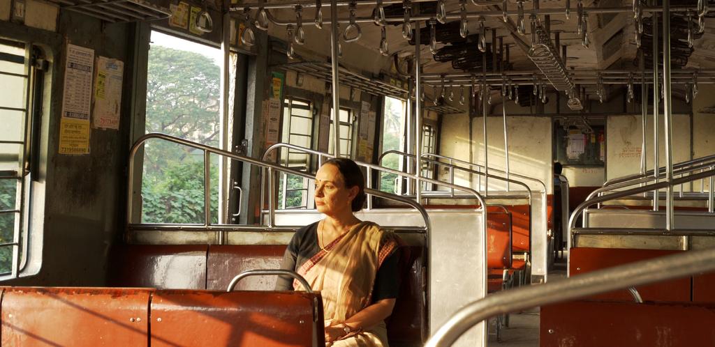 LOGLINE SHORT SYNOPSIS Amidst the daily din of the local trains in Calcutta, a lonely working woman in her late fifties finds herself falling in love with the voice of