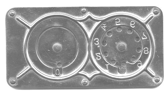 In addition to the six rivets at the edges and the two rivets for the dials, there are now two protrusions for the detent mechanism. See below. Figure 4. Back of the Type I Stephenson Adder.
