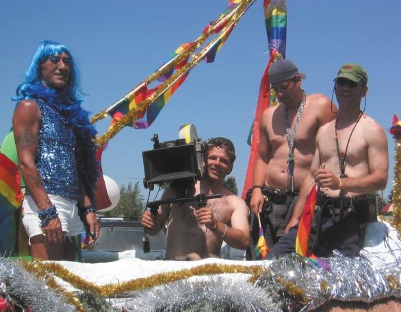 CAMERA PRIDE: Serge Desrosiers csc gets into the spirit of things from atop a gay pride float.