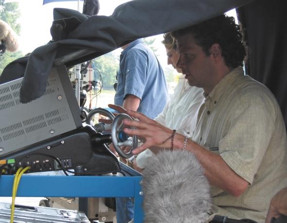 HOT GEARS: In a shaded break from his hand-held photography, DOP Serge Desrosiers csc runs the controls of the Hot Gears remote system from David J. Woods Productions.