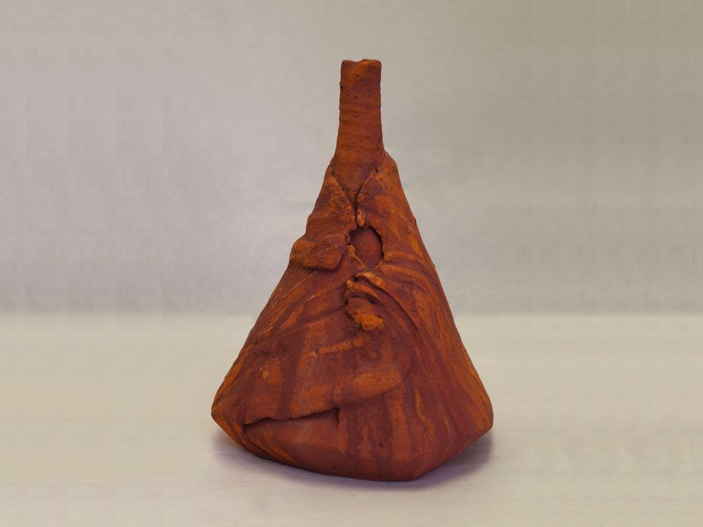 Figure 2: Martie Geiger-Ho, Thrown Hill-Draped Vessel, Cone 04 electric kiln fired red earthenware clay from UBD campus, unglazed with colored with oxides. 9.