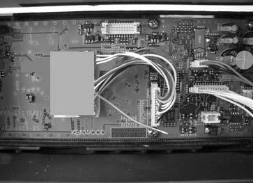 Peel off the cover of the tape on the rear surface of the SC20-460 board and install the board to the following location.