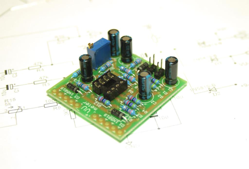 the board - minus marked on the capacitor casing.