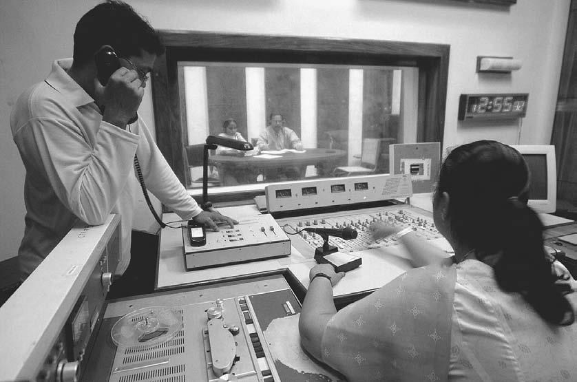 RADIO 131 Indian engineers of the state-run All India Radio (AIR) work on a phone-in program at Port Blair, 3 January 2005.