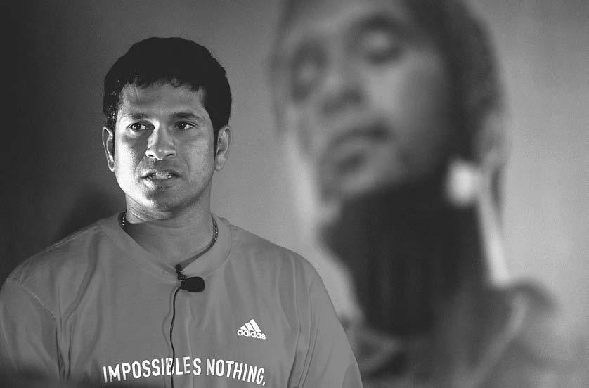 166 POP CULTURE INDIA! Indian cricket star Sachin Tendulkar speaks to reporters at a promotional event for a sports shoe company in Mumbai, 12 August 2004. (Shyam Sunder/Reuters/Corbis) 2003).