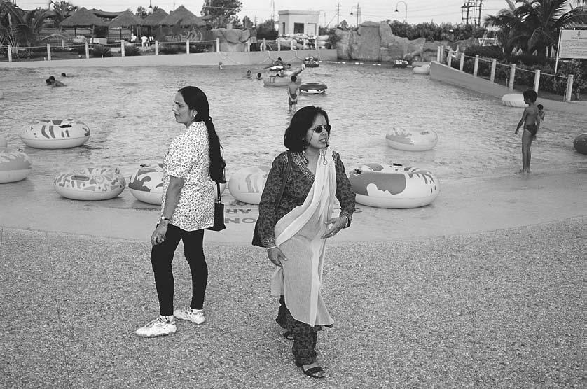 300 POP CULTURE INDIA! Women at a Western-style water park in Bangalore, 1999. (David H.