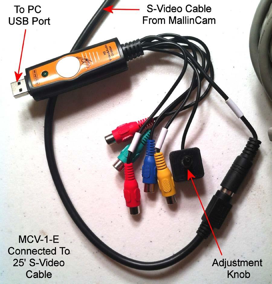 FIGURE 17 The flat end of the MCV-1-E is inserted into a USB Port on the