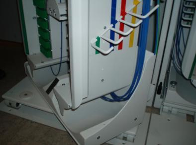 The function of the hangers is to organise surplus patch cord. The hangers placement is controlled by the surplus to be handled.