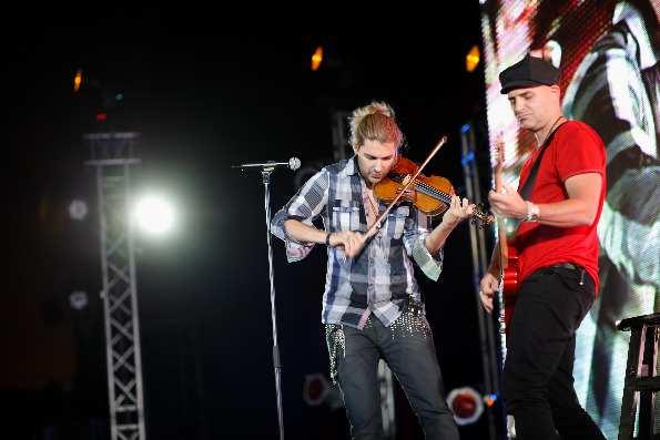 David Garrett performs with guitarist Marcus Wolf on stage and their chemistry is impeccable; both musicians feed off each other's energy and make both string instruments sound like they have