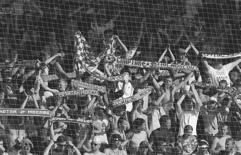 272 POP CULTURE RUSSIA! Supporters of Spartak Moscow at a match of their team against Saturn in July 2003. (Photo by Dmitry Azarov/Kommersant) that point, the police closed three of the four exits.