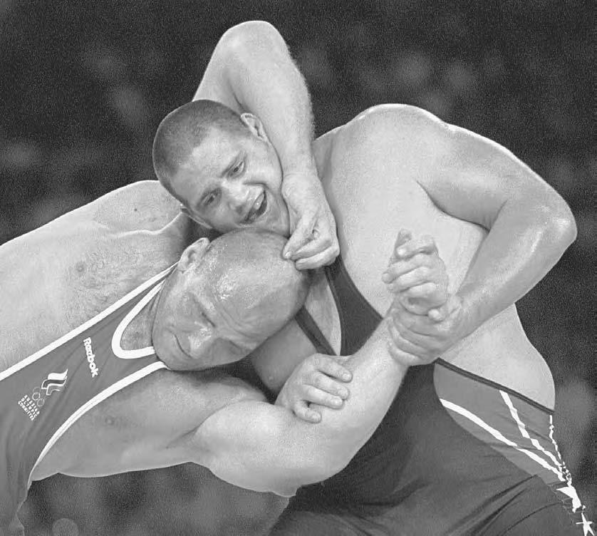 282 POP CULTURE RUSSIA! Russian three-time Olympic champion in Greco-Roman wrestling Alexander Karelin fights during the 2000 Summer Olympics in Sydney.