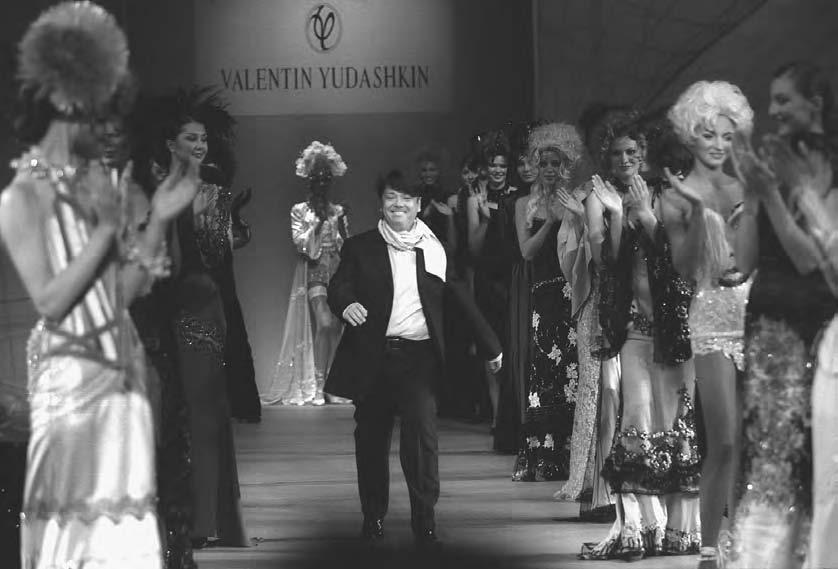 CONSUMER CULTURE 359 Couturier Valentin Yudashkin walks along the podium during the final ceremony of the Ninth Haute Couture Week at the Rossiya Hotel in Moscow in 2002.