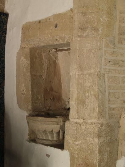 The chancel was largely rebuilt in the mid 13th century but, in the south east corner, this late 12th century piscina, with a bowl