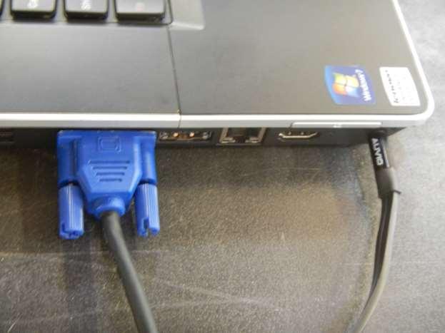 Set up your laptop computer on the middle section of the video cart. Connect the other end of the blue video cable from the video projector to your computer video out connector.