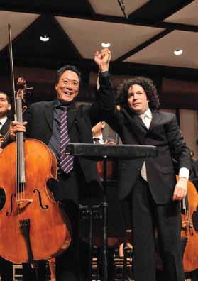 Before going out on stage, the members of the brass section pose for a photo Dudamel and Yo-Yo Ma in Caracas to other players born in the cradles of the great composers.