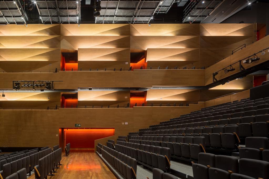 IA-250.06 The theater interior space is designed with a combination of folded acoustical wood panels and an acoustical fabric.