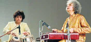don t play in the same city with other organization. We requested him and finally on 26-2-1997 his programme was fixed at Akota Stadium. He was accompanied by Ustad Sultan Khan on Sarangi.