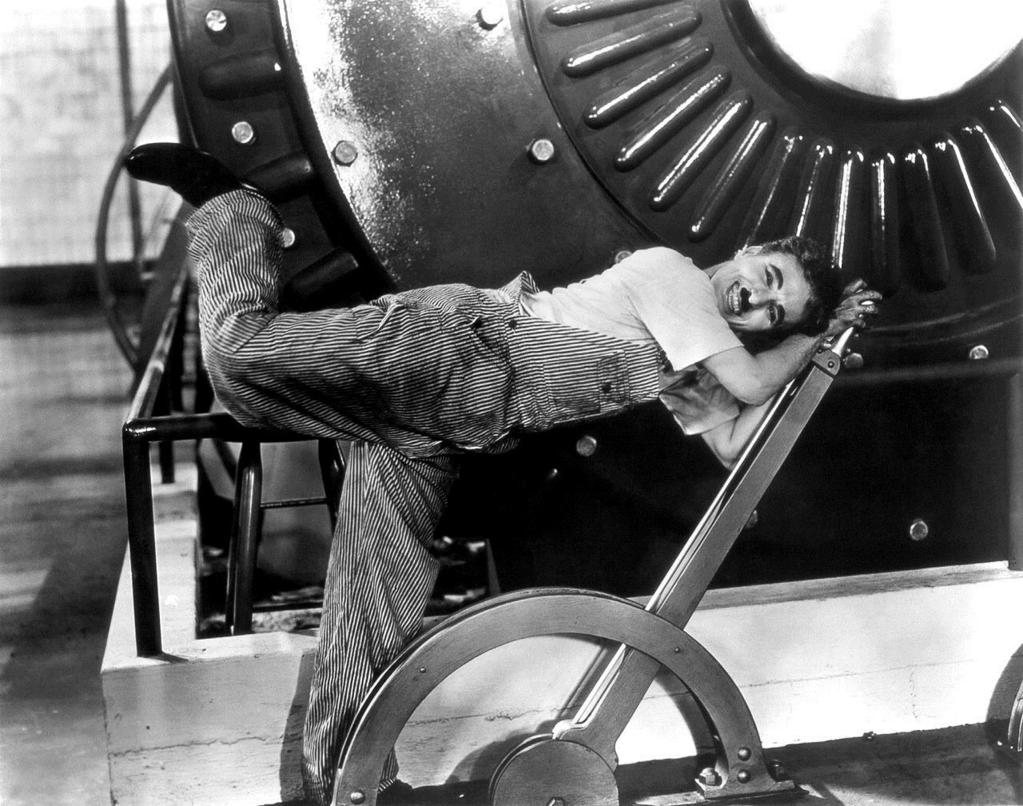 Modern Times (1936) Modern Times (1936) Factory Work Scene The Little Tramp is a worker in a massive clock-work conveyor belt whatever while being subjected to many of the indignities of modern