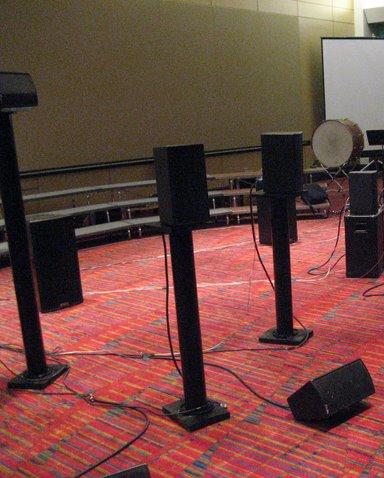 speakers to angle the driver up. The tiered heights of the speaker stands were designed to give the impression of depth in the sound image of the listener.