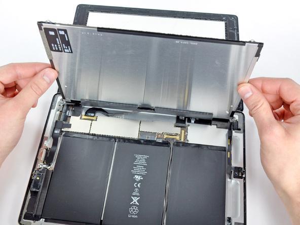 Next, we will take the new assembly that should come with adhesive already on it and slide the digitizer cable into the cable connector and close the two black doors back down.