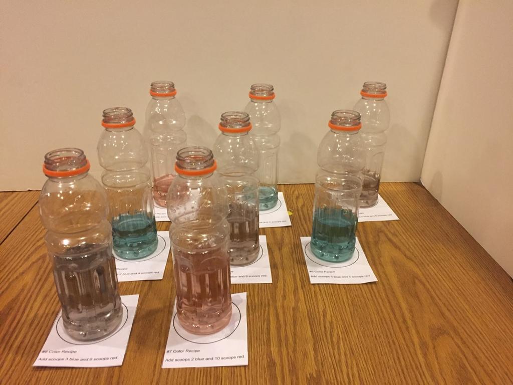 When they finish, have students place their bottles, mixed according to their specific recipe, on top of their recipe cards in a central location where they are visible for the whole class.
