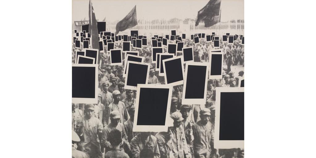 instead of revolutionary propaganda posters, the demonstrators carry copies of Malevich s Black Square. This produces a certain ironic effect.