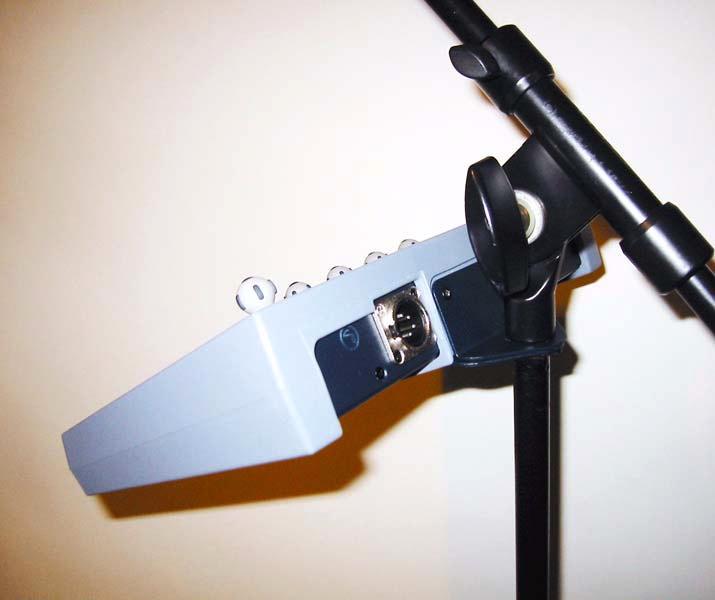 3 Affix the PQ Controller mounting bracket to any standard microphone mount, and secure it with a nut