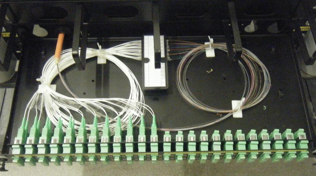 28 Photo 7: Fibre tray internal organisation d) Each fibre cable should have no more than 1m excess coiled and secured to the side of rack.