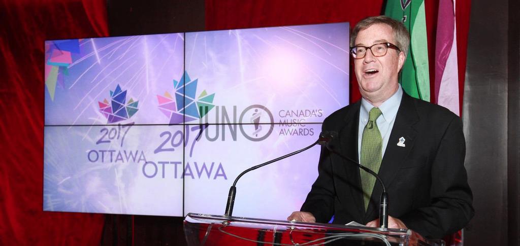 Mayor Jim Watson at 2017 JUNO Awards Announcement (Photo: Ottawa 2017) Background Announced by Mayor Jim Watson at the kick-off of the 2017 JUNO Awards, this project is the culmination of efforts
