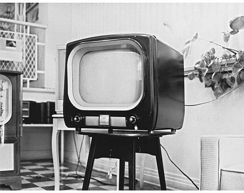 Third Wave: Television (1950-2000) Television, the third wave, is the optical medium that comes into the home. If cinema is the urban, modern medium, television is the suburban, postmodern medium.
