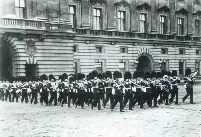 Forecourt Foray: Band and Corps of Drums exit Buckingham Palace (1919).