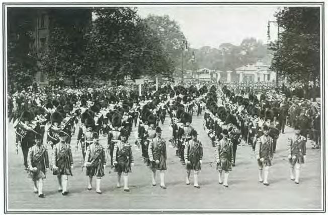 9 Drum Majors in State Dress head the first section of a 564-strong Massed Bands and Drums of
