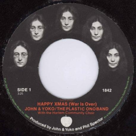 First issues have a custom label showing John's face blending into Yoko's (in stages). Later copies have a regular Apple label.