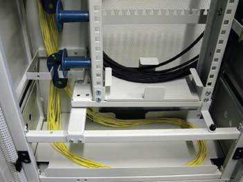 Guide all extra patch cord lengths to the cabling space on the left side of the frame and further to the bottom of the frame, if needed.