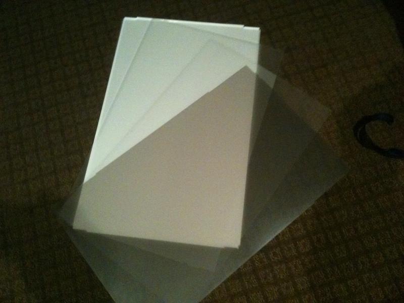 A perspex sheet with white plastic coating, 2 opaque matt plastic sheets, and 1 Pearlescent matt