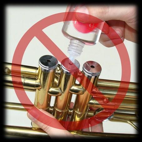 Drop the valve into the casing and turn it until it clicks into place. Do not add oil by dripping it into the holes on the bottom of the trumpet valve casings.