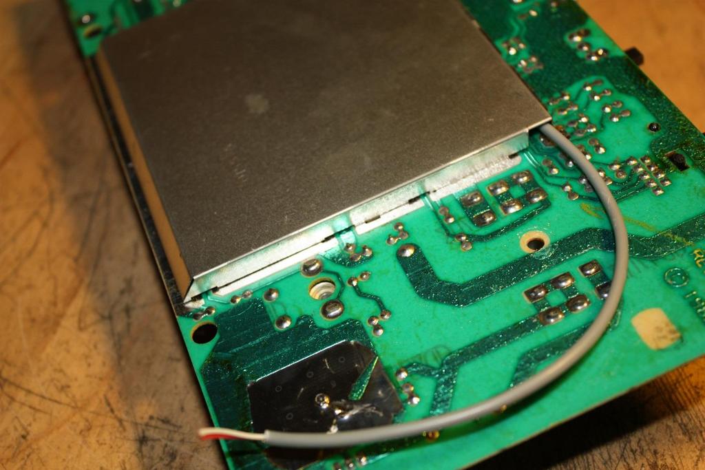 Carefully place the PCB assembly into the case as shown