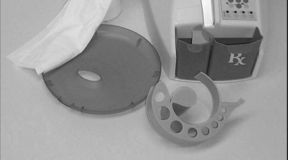 To avoid errors in pill counting, the optic sensors must be cleaned daily. The optic sensors are located at the bottom of the pill chute. A soft cloth should be used to wipe the sensors clean.