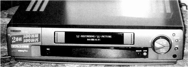 SHOW REPORT Sharp's VCBF80 dual - recording capability VCR. Fig. 1. Head drum arrangement used in the Sharp VCBF80 dual - recording VCR. Fujitsu's prototype gas - plasma display. would cost!