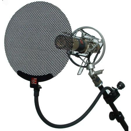 The pop shield is placed between the vocalist and the microphone.