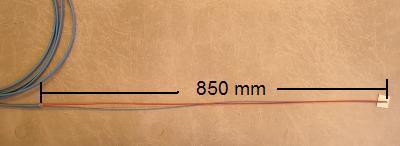 measuring from the centre of the cassette, must be 1300 mm, see the arrow in the diagram. If blown fibres are being installed, 350 mm of acrylate must be stripped from the end of the fibre.
