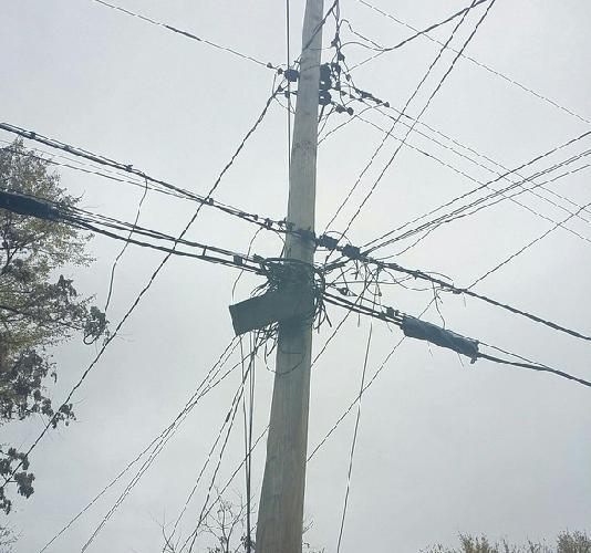 The picture below from 1105 Elbank Avenue, Baltimore City, MD shows a terminal that is not attached to the pole. It appears to be wrapped and tied to the pole with wires and cable ties.