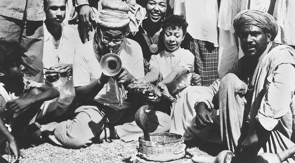Dizzy Gillespie performing for snakes in Karachi, Pakistan, 1956, as part of a government-funded jazz tour during the Cold War.