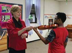 one-on-one music lessons with a qualified teacher during the school year, perform in an annual